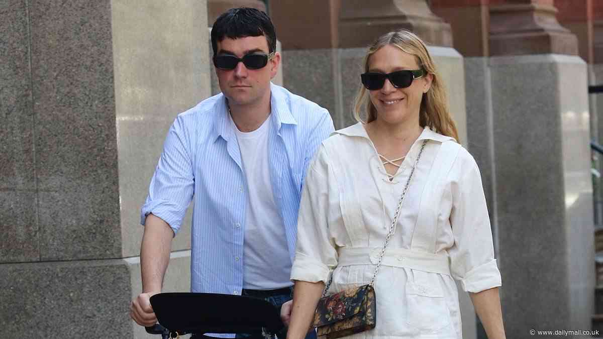 Chloe Sevigny puts on a VERY leggy display in black shorts while enjoying Memorial Day weekend with family in SoHo