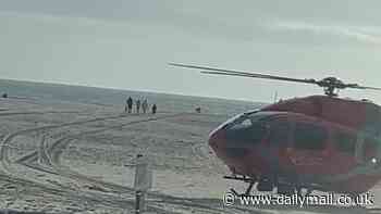 Two Coastguard helicopters descend on Welsh beach after 'father and his two sons' got into difficulty