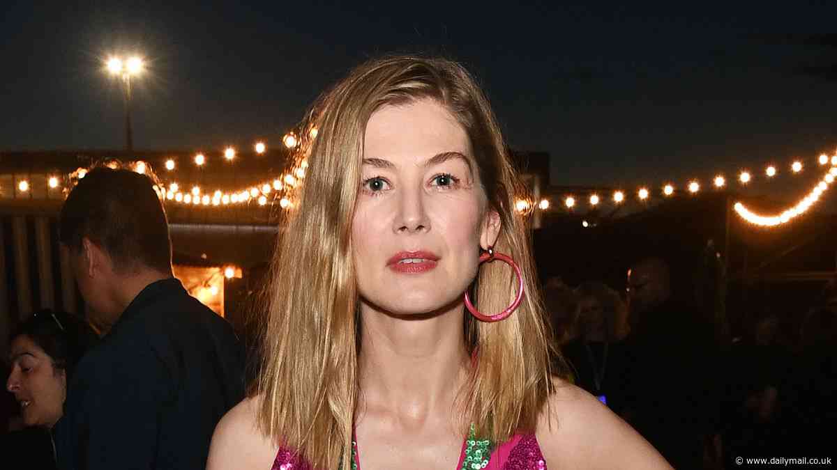 Rosamund Pike dazzles in a glittering floor-length jumpsuit as she makes an appearance at the ABBA Voyage second anniversary performance