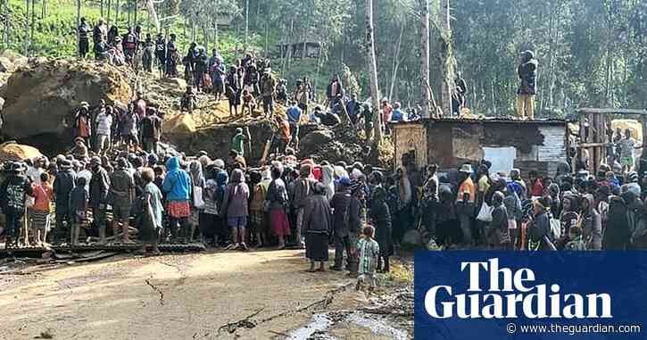 People in Papua New Guinea dig through mud and debris after huge landslide – video