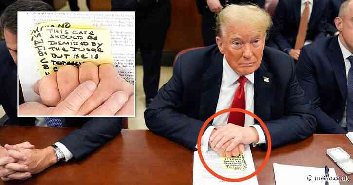 Donald Trump holds handwritten note reminding him of his own hush money trial comments