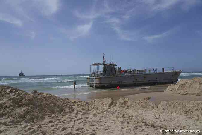Aid deliveries suspended after rough seas damage US-built temporary pier in Gaza, 3 US officials say