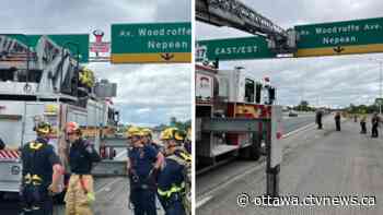 Ottawa firefighters, police bring down protesters from Hwy. 417 signs, causing delays