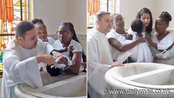Shocking moment priest pulls baby's head back while pouring holy water at baptism