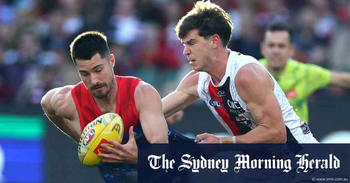 AFL orders umpires to tighten holding-the-ball rule