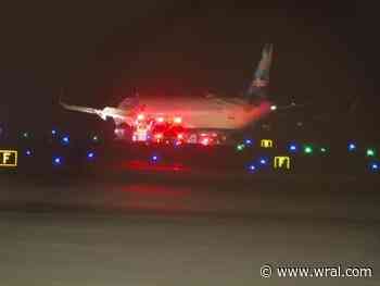 Emergency crews gathered around plane on runway at RDU. no one injured