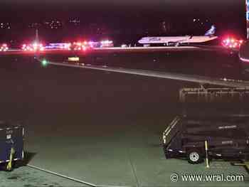 Emergency crews gathered around plane on runway at RDU, no one injured