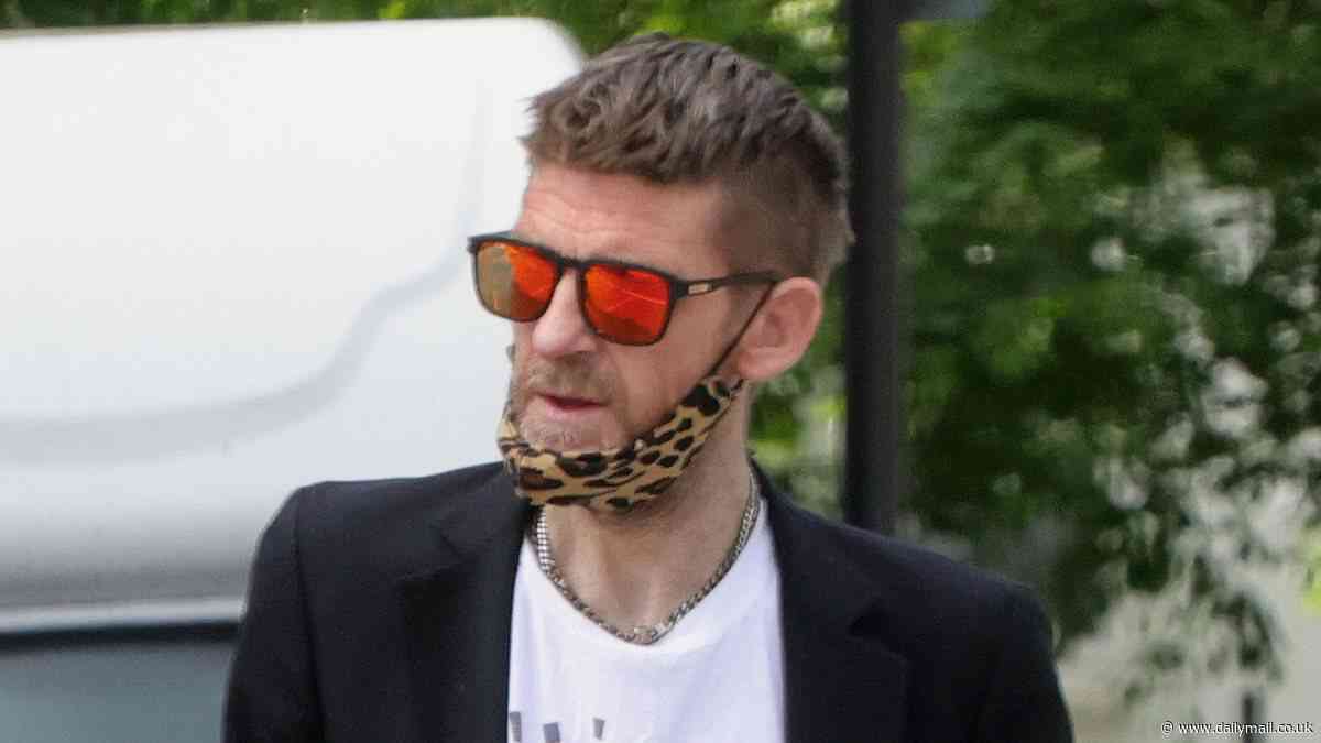 Paul Anderson pulls on a smart suit for a shopping trip as troubled star allays fears his well-being after he was pictured walking the streets topless - months before starting work on Peaky Blinders film