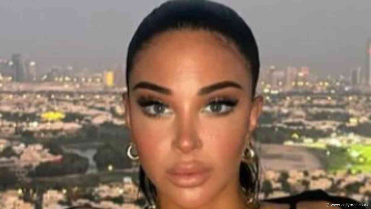 Tulisa Contostavlos showcases her enviable figure in a black bikini as she sports a huge gold chain on holiday in Dubai