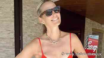 Molly Sims, 51, is called 'gorgeous' by her fans as she models a red one-piece swimsuit in Palm Springs... after sharing her diet secret