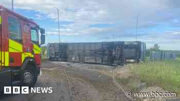 Drivers face delays as overturned coach spills fuel