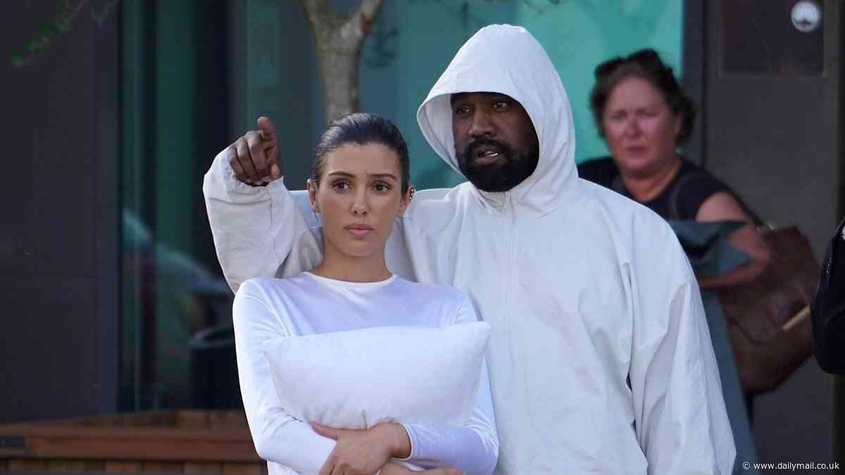 Why Kanye West's wife Bianca Censori REALLY carries a pillow over her breasts and the intriguing details it reveals about their relationship, according to a body language expert