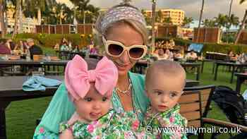 Paris Hilton cuddles with baby daughter London, six months, and son Phoenix, one, on the beach during 'magical' family vacation in Maui