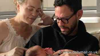 Baby joy! Melissa George tenderly dotes over her newborn son Lyor after giving birth at 47