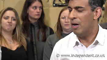 Worker pulls faces as Rishi Sunak says ‘life has been difficult’ in election campaign speech