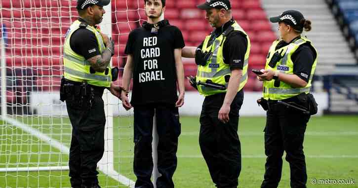 Protester chains himself to goalpost before Scotland’s Euro qualifier vs Israel