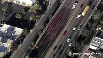 Look: Plow clears meat spilled on Oakland highway