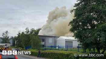 Smoke pours from industrial unit fire