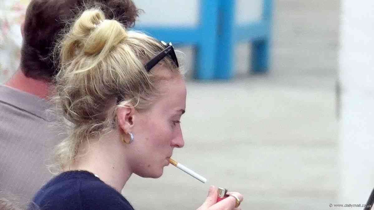 Makeup free Sophie Turner puffs on a cigarette as she is joined by her boyfriend  Peregrine Pearson for romantic getaway to Capri