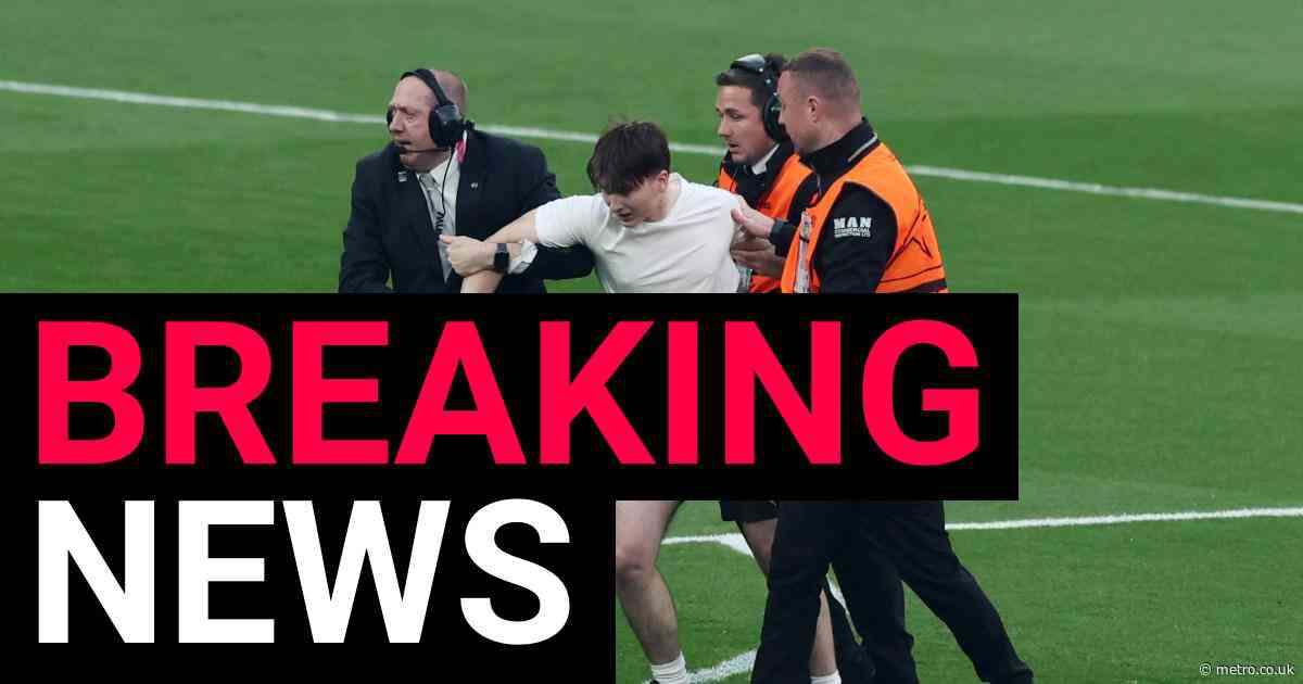 Champions League final interrupted by pitch invaders after less than a minute