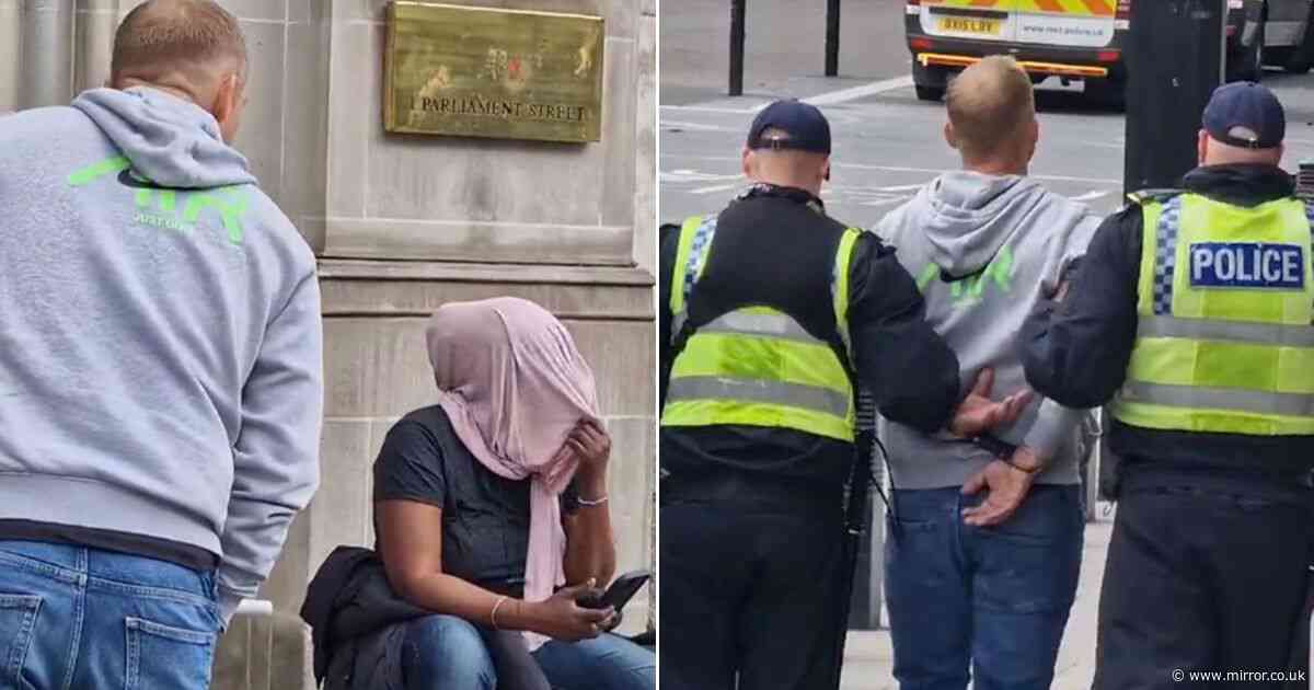 Moment man hurls abuse at Muslim woman and is instantly handcuffed at Tommy Robinson protest