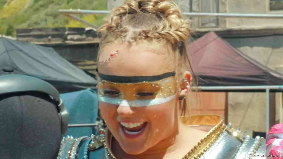 JoJo Siwa embraces her inner superhero as she teases music video for new track Choose Your Fighter... following controversial Karma single and major rebrand: 'Level up!'