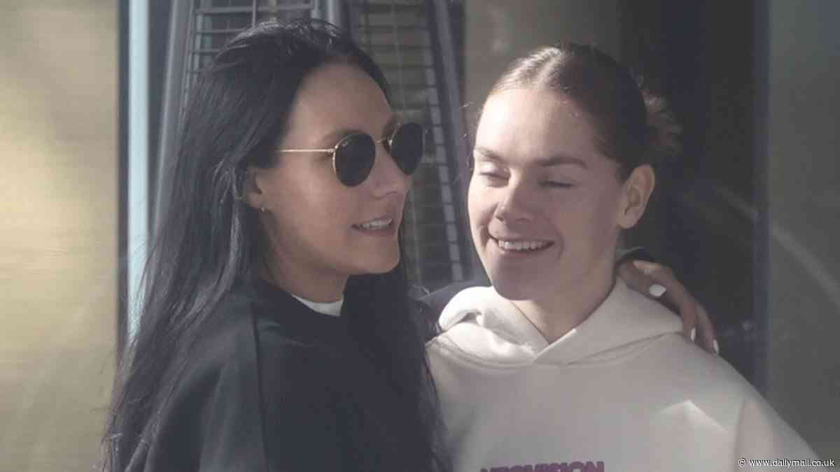 Matildas debut forward Sharn Freier packs on the PDA with fiancée as they go for a morning stroll in Sydney with the team - ahead of the Tillies rematch against China