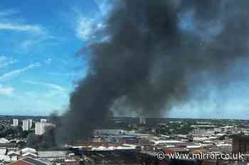 Explosions reported as fire rages in Birmingham and people told to avoid area
