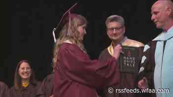 'Under his eye': Student hands superintendent banned book at graduation