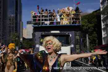 Gay pride revelers in Sao Paulo reclaim Brazil’s national symbols