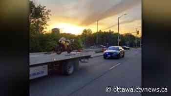 Motorcycle doing wheelies, weaving in, out of traffic caught on Highway 417