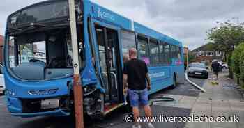 Bus careers onto pavement before smashing into car and lamp posts in terrifying crash