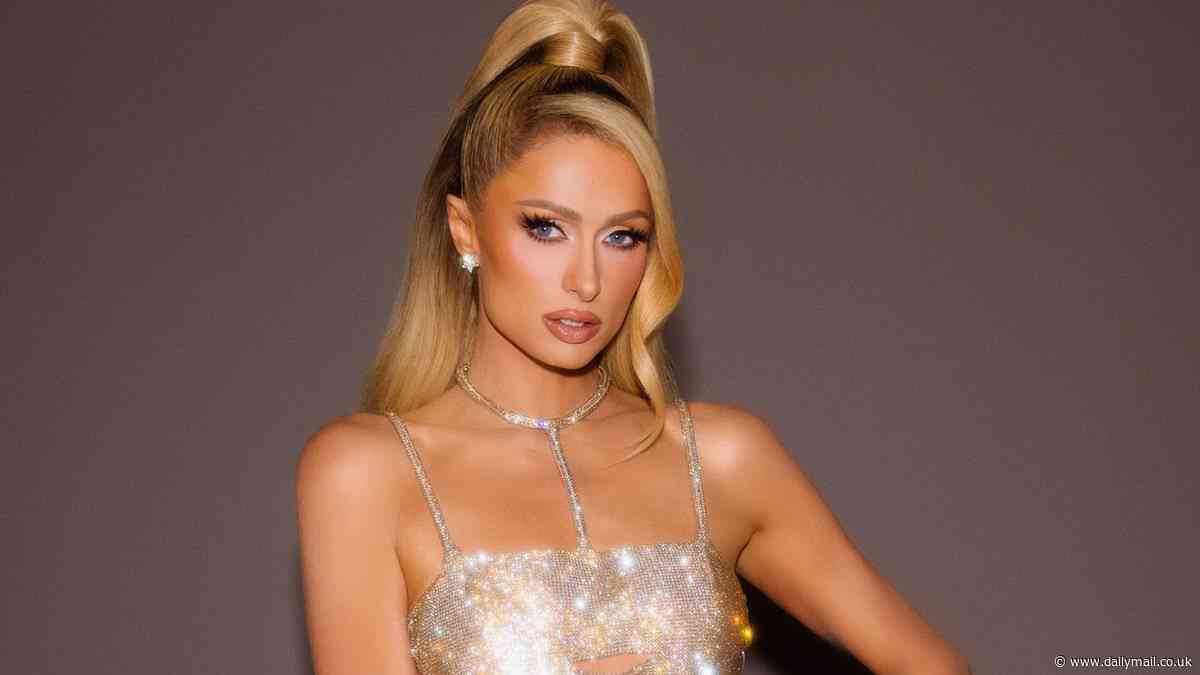 Paris Hilton, 43, calls herself the 'It Girl blueprint' while flashing the flesh in sparkling cutout mini-dress... after announcing sophomore album