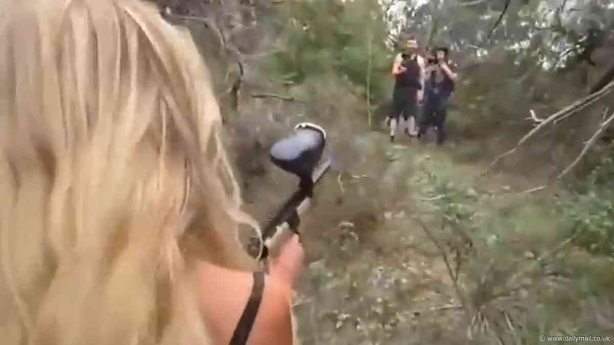 US streamer Natalie Reynolds is seen in wild clash with scavenger hunter who accuses her of assault - just days after convincing vulnerable woman to jump into lake