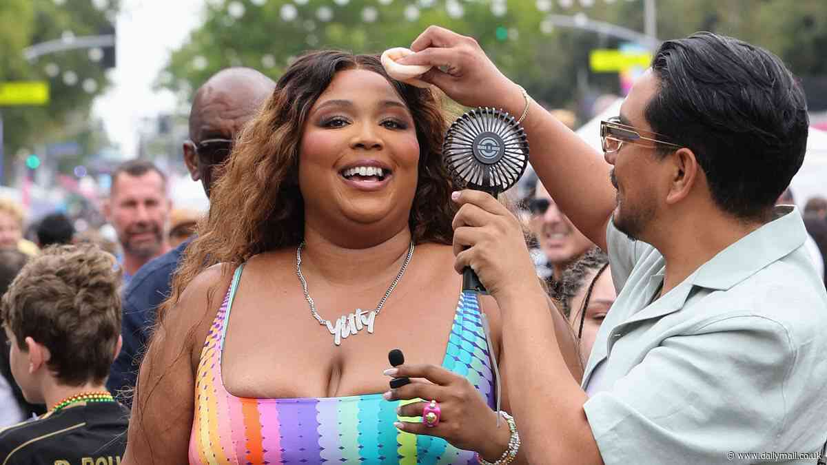 Lizzo flashes her midriff in clinging rainbow-colored Yitty two-piece as she attends Pride festival in LA