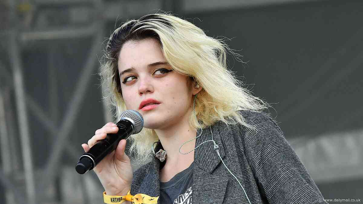 Aussie fans turn on Sky Ferreira following 'strange' concert which saw her arrive on stage 80 minutes late - then performing in the dark
