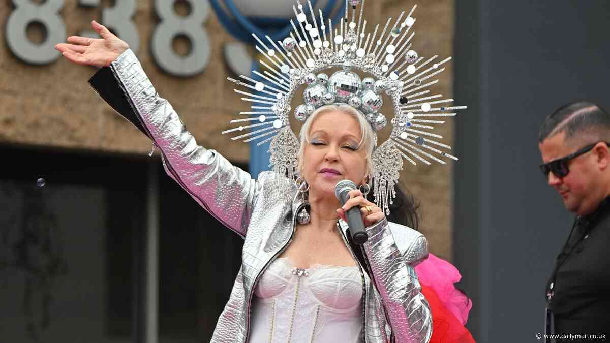 Cyndi Lauper looks angelic in silver headdress over her platinum locks as iconic 1980s pop star serves as  Lifetime Ally Icon who leads celebs at WeHo Pride Parade in LA
