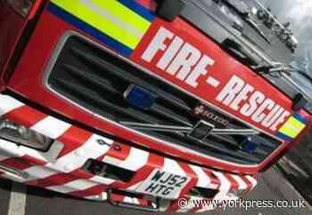 Ripon: boy on Bondgate Green rooftop, firefighters on scene