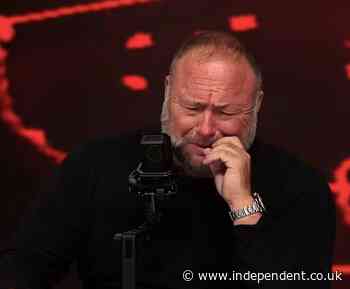 Conspiracy theorist Alex Jones breaks down sobbing on Infowars show claiming feds are trying to shutter show