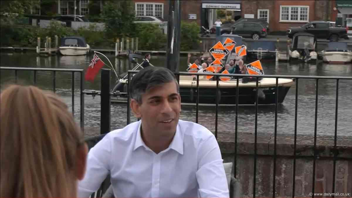 Rishi Sunak's new small boat problem: Lib Dems photobomb PM on the River Thames after spotting him campaigning in the same affluent seat ahead of the election
