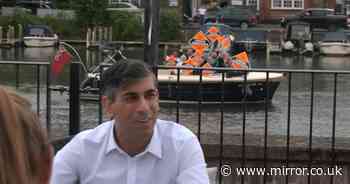 Awkward moment Rishi Sunak mocked by small boat activists in live interview