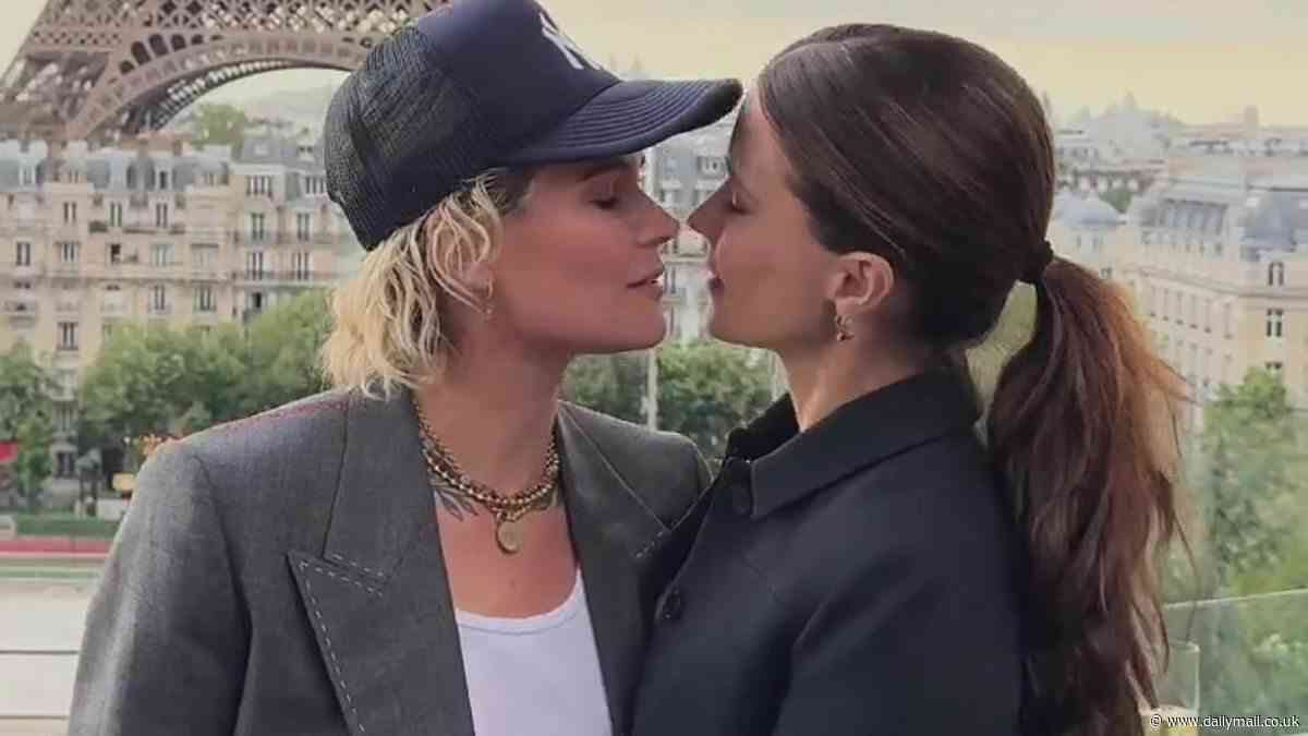 Sophia Bush shares passionate kisses with her girlfriend Ashlyn Harris while in France as she calls the soccer star 'mine'
