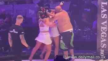 Bizarre MMA fight in Romania goes viral as one man takes on two women - with fans left baffled by strange encounter