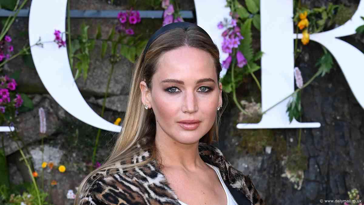 Jennifer Lawrence cuts a chic figure in a leopard print coat as she joins stylish Lily Collins and Emma Raducanu at star-studded Dior show in the grounds of a picturesque Scottish Castle