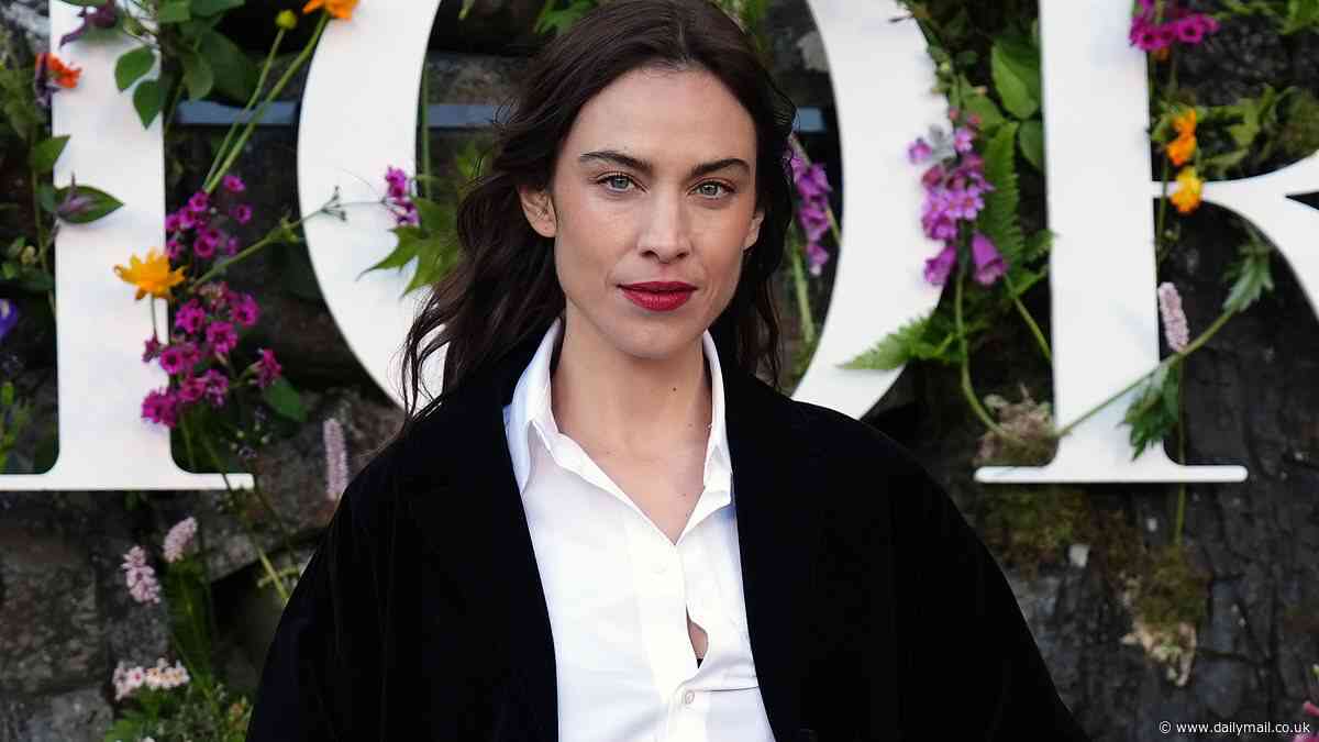 Alexa Chung puts on a VERY leggy display in tiny black shorts as she keeps it stylish at Dior show
