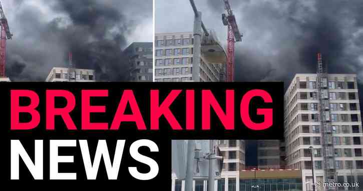 Huge plumes of smoke rise from new build flats after fire in central London