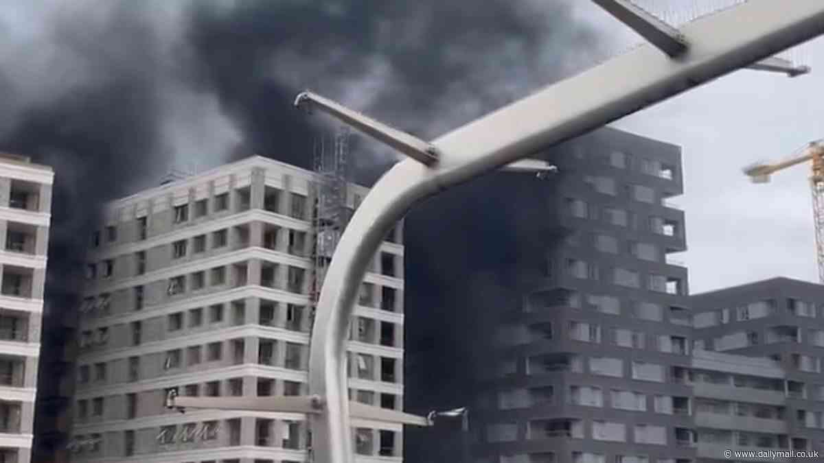 Huge fire breaks out on building under construction in east London