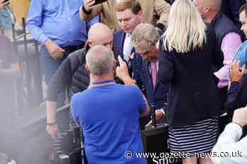 Nigel Farage has a drink thrown over him in Clacton