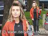 Dani Dyer keeps it casual as she leaves the hair salon with her rollers still in as she enjoys some self care