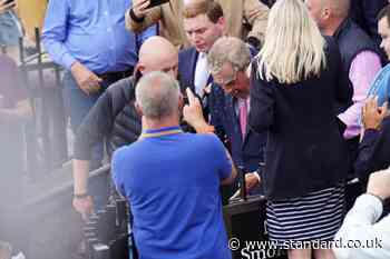 Nigel Farage doused with milkshake outside pub